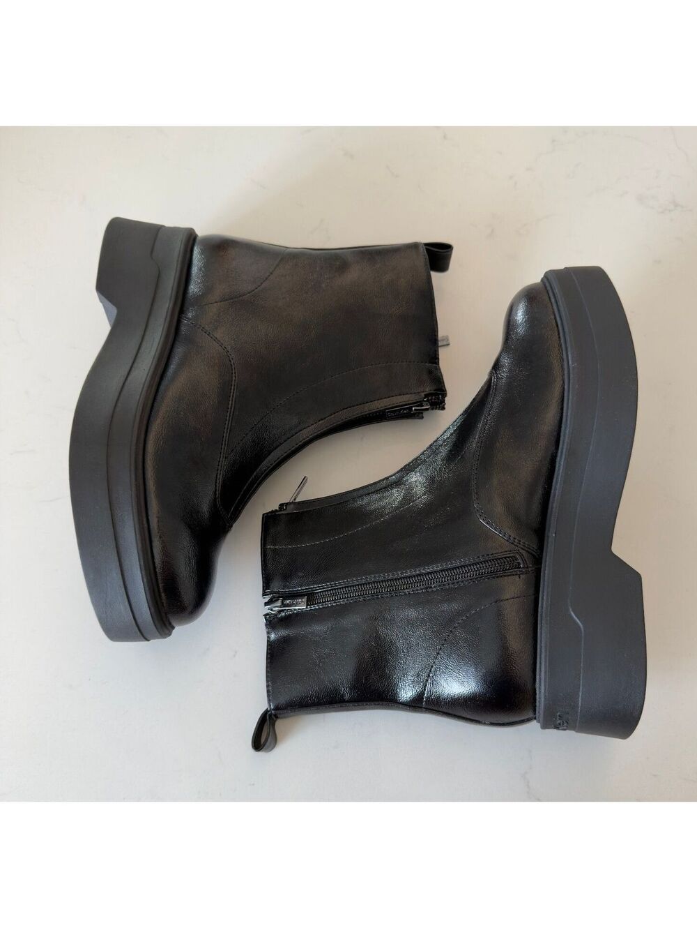 Calvin Klein Black Smooth Rivin Front Zip Platform Booties Women